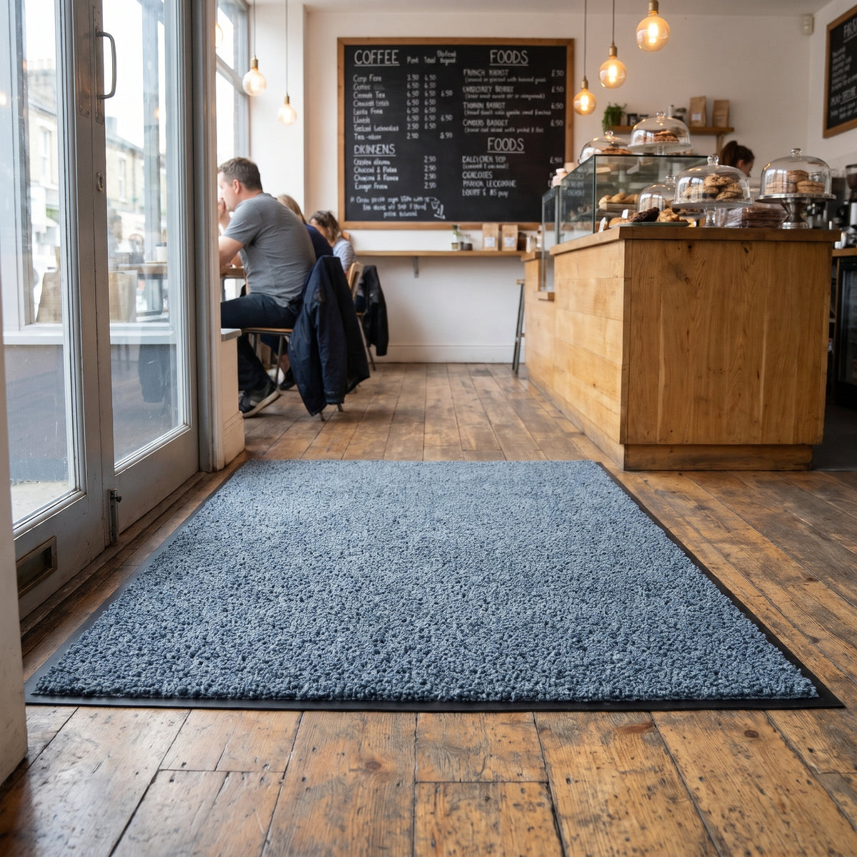 Slate Grey made to measure shop entrance mat fitted to the doorway width of an independent coffee shop