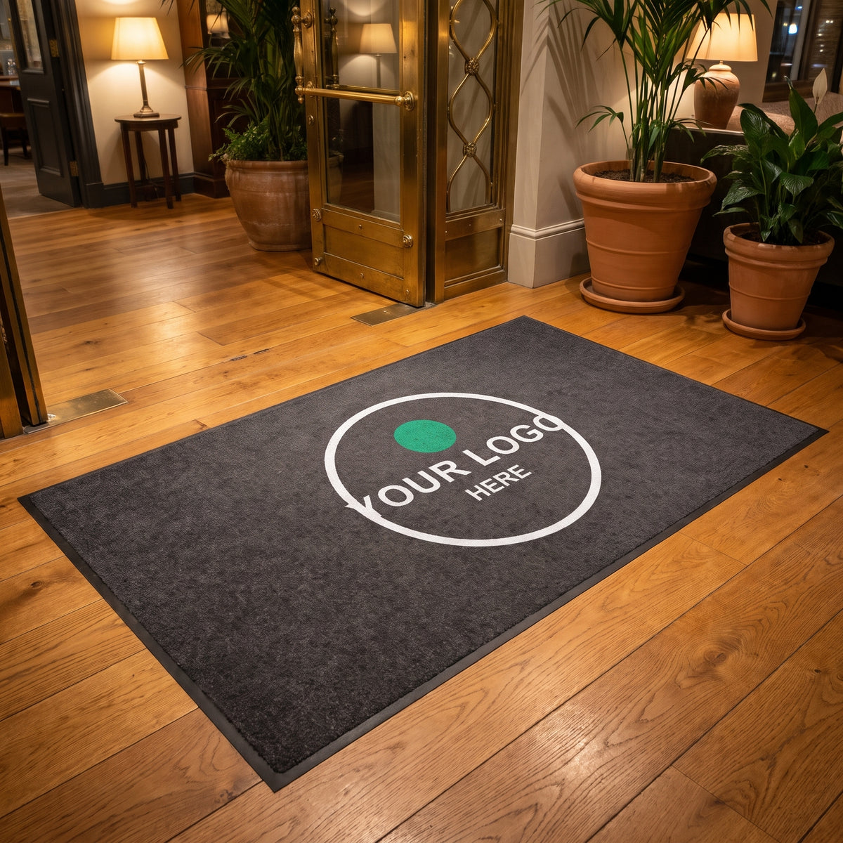 Custom logo mat on a wooden floor in a hotel lobby entrance